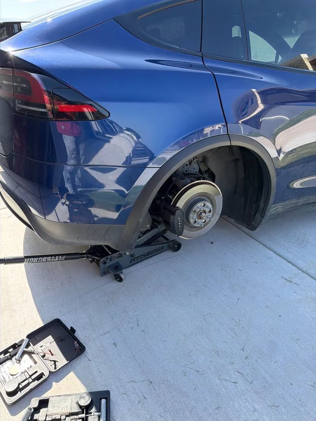 Tesla Model X jacked up for mobile tire service in Dallas, TX — All Hours Roadside